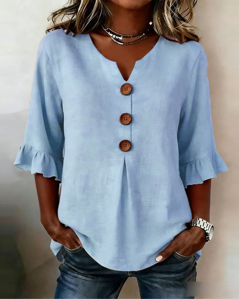 Blusa Sophia de algodón-lino con botones de madera y volantes