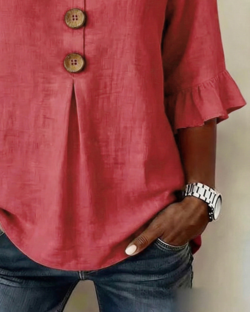 Blusa Sophia de algodón-lino con botones de madera y volantes