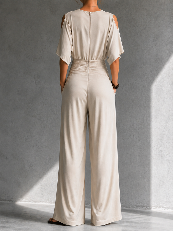 Combinación elegante con efecto cartera y piernas anchas