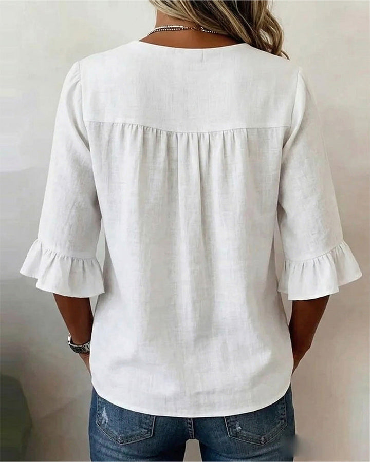 Blusa Sophia de algodón-lino con botones de madera y volantes