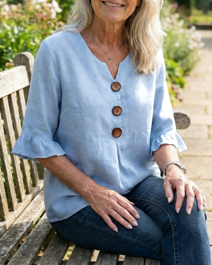 Blusa Sophia de algodón-lino con botones de madera y volantes